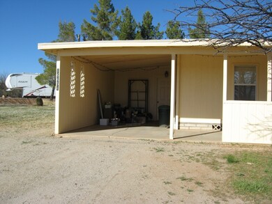 Covered Carport opens to Storage Room