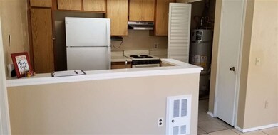 Shows laundry closet in kitchen