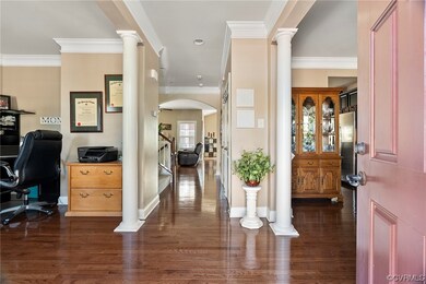 Wood floored office space with decorative columns