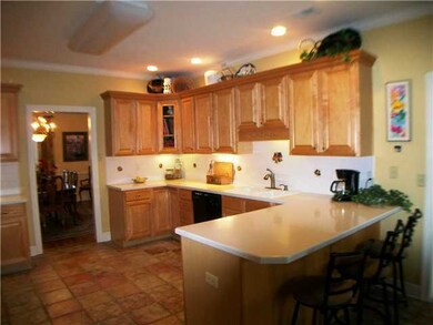Custom maple cabinets in kitchen & vanities with r