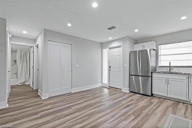 Kitchen featuring backsplash, stainless steel refr