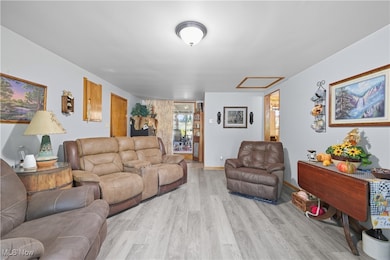 Living room with wood finished floors and baseboards