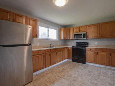 The home features a specious kitchen area.  The ki