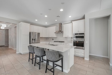 Kitchen featuring stainless steel appliances, wall