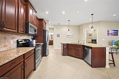 Open floor plan with spacious kitchen featuring st