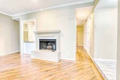 A charming fireplace is the focal point of the fam
