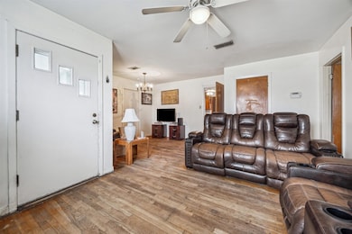 Spacious living area open to the extra room with a