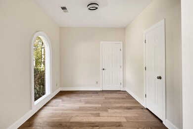 Unfurnished room featuring light hardwood / wood-s