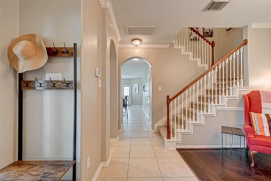 Elegant archways and crown molding throughout.