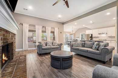 The spacious open concept family room has high cei