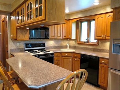 Updated kitchen that makes good use of overhead st