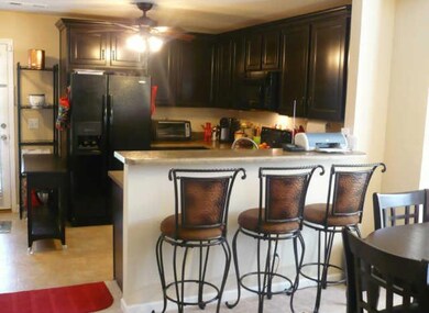 KITCHEN HAS UPGRADED CABINETS AND INCLUDES ALL APPLIANCES. BAR AND DINING ROOM MAKE ENTERTAINING EASY!