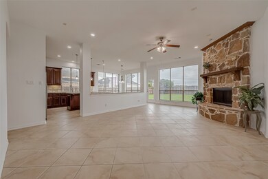 Floor to ceiling windows flood the room with natur