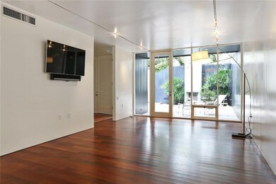 LIVING ROOM OVERLOOKING FRONT PATIO