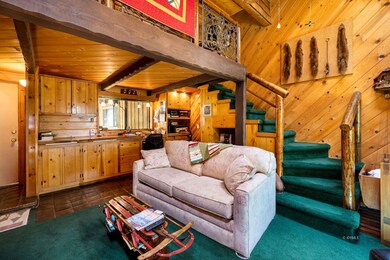 Viowards living room and stairs to loft.