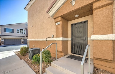 Entrance to property with stucco siding