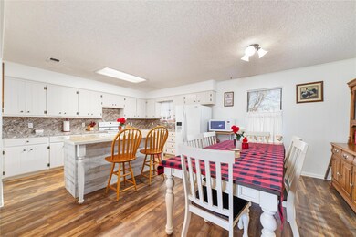 Dining area featuring dark wood-type flooring and 