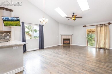 Living room / dining combo, with fireplace, wood-t