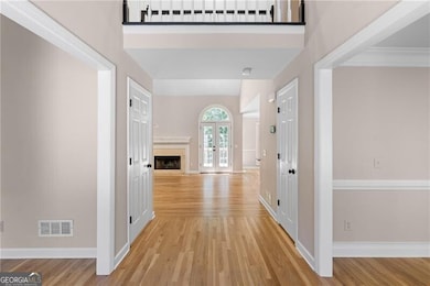 2 story foyer with a dining and living room/office on either side