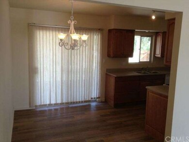 Dinning and kitchen with sliding glass door to bac