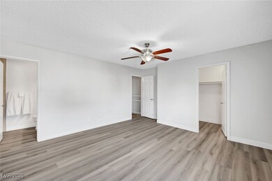 Primary bedroom 1 with a walk in closet