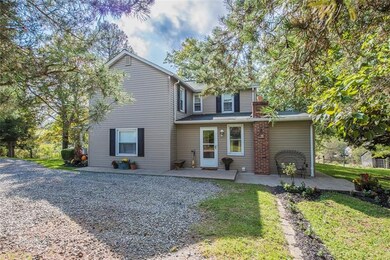 Parking pad alongside the kitchen entry.