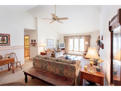 Vaulted ceiling, open living and bright large wind