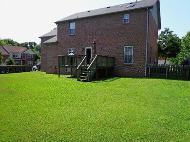 Rear view of house and yard
