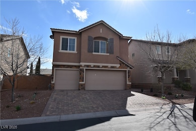 View of front of property with stucco siding, stone siding, an attached garage, and decorative driveway