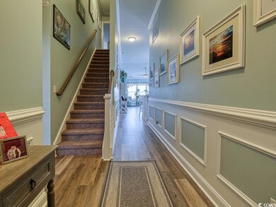 Staircase featuring hardwood / wood-style floors a