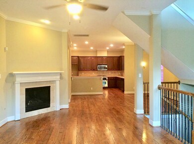 View of 2nd floor open living space with gas burni