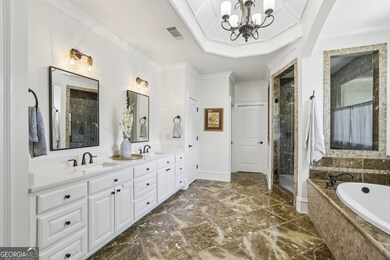 The Spa-Like Bath features Marble Tile, a Soaking Tub, and a Steam Shower worthy of a five-star retreat.