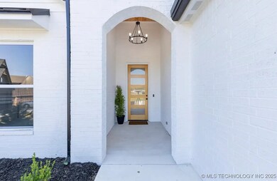 Charming entry with candelabra light fixture and w
