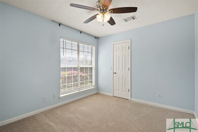 Front bedroom or office space. New carpet