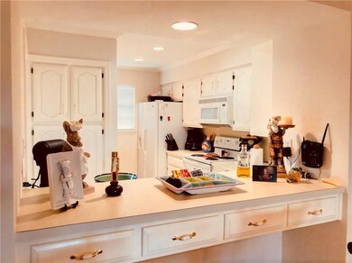 Light and bright kitchen with convenient bar seati
