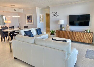 Living room featuring a textured ceiling and crown