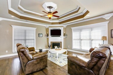 Another View of Living Room - Notice the detailed crown molding as well as the extensive window trims.