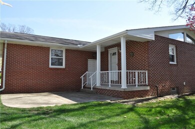 covered porch and concrete patio