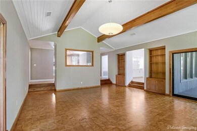 Step down family room looking toward the entry, be