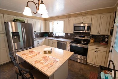 High end cabinetry with Quartz counters, center is