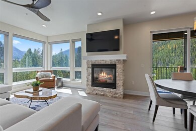 Living room featuring a stone fireplace