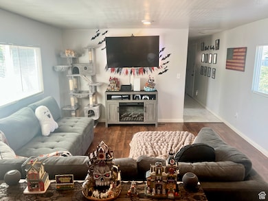 Living room with wood finished floors and baseboards