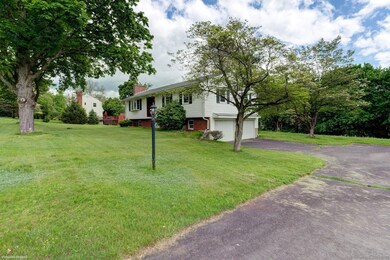 Driveway entrance and convenient 2 car garage unde