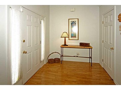 Entry. The covered front porch leads you into the airy 2-story foyer with new flooring.