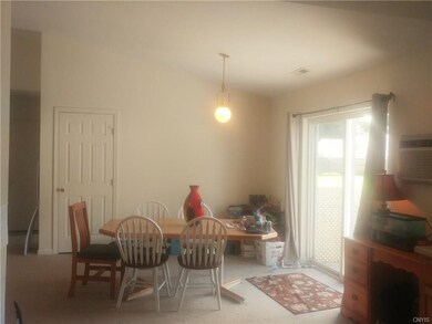 Dining Area with sliders that lead to back deck an