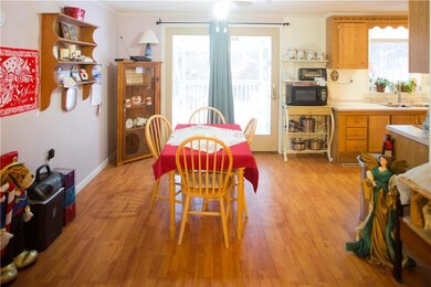 Dining area with door to backyard deck