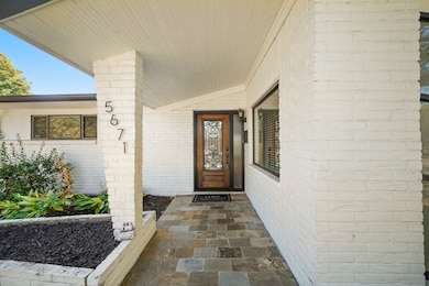 Friends and Family will feel Right at Home when they Step onto the Front Porch which features Slate Tile, Raised Ceiling, Coach Light, and Ring Doorbell.  The Natural Walnut Hued Forged Iron Front Door, with 'Adjacent Glass Sidelight, isa Beautiful Entry to this Stylishly Updated Home.