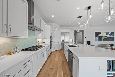 Chef's kitchen, complete with cooktop w/hood, sing