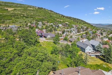 Aerial view of residential area featuring a mountain backdrop