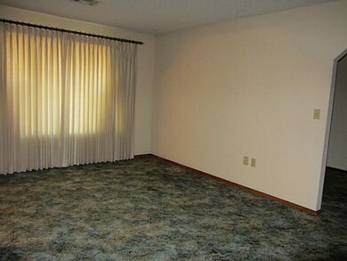 Living Room. Formal living room has large window a
